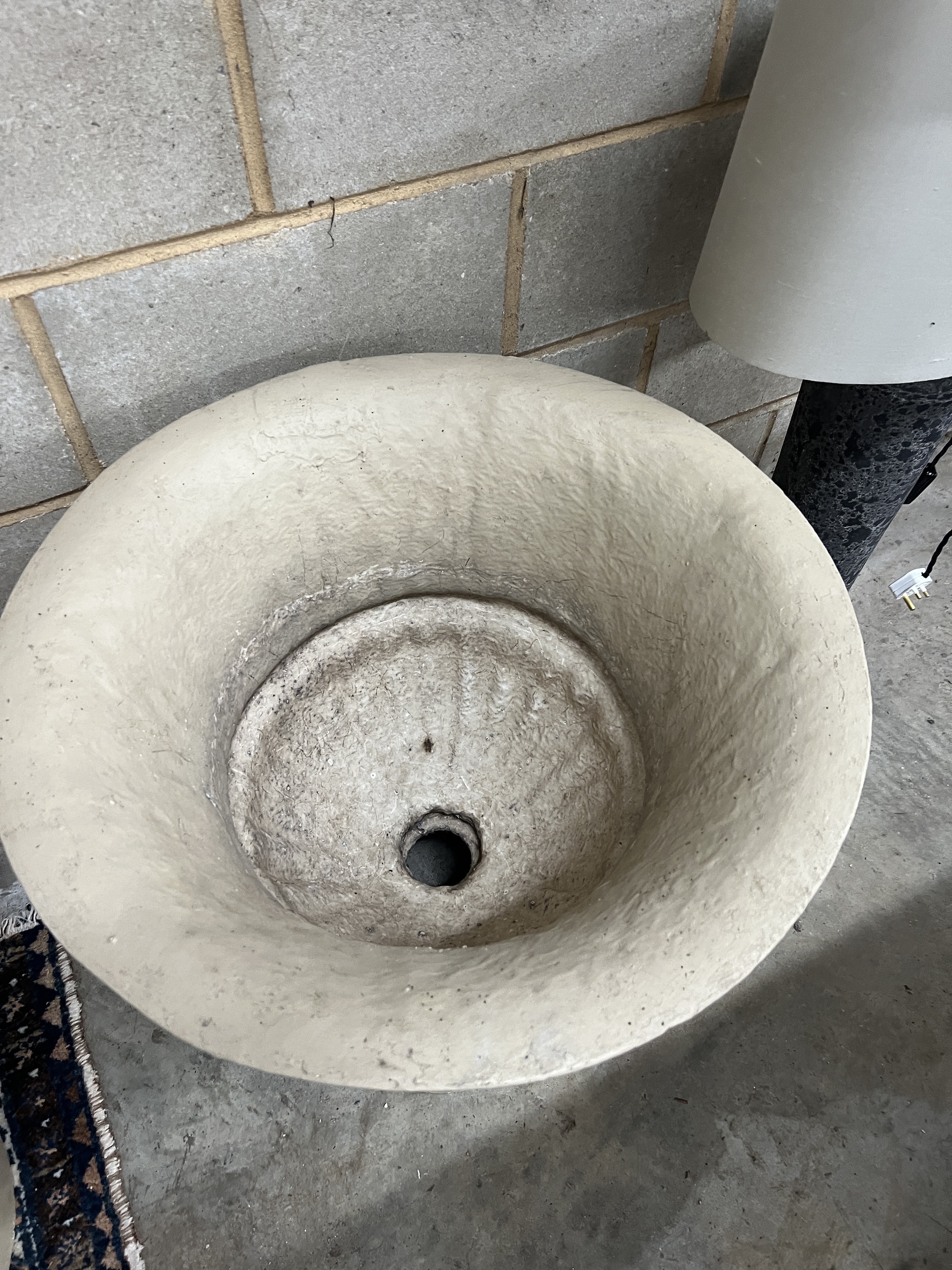 A pair of composition faux stone circular garden planters, diameter 62cm, height 60cm